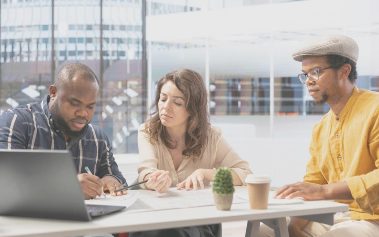 Family reviewing investment portfolio together at kitchen table